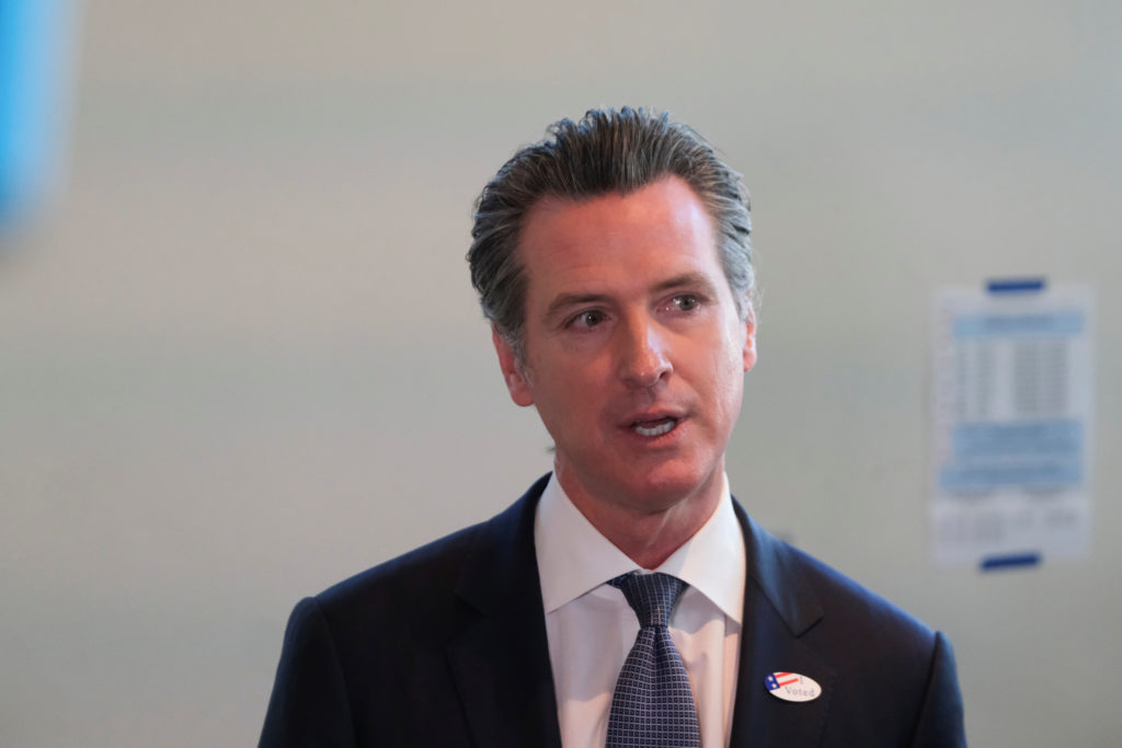 California's Governor Gavin Newsom speaks to the media after casting his vote at a voting center at The California Museum ...