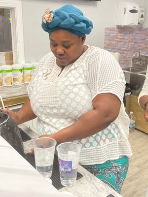 Stephanie Simplis is making tea.  A ribbon cutting was held Friday for her third business, JoyFull Nutrition.  The new business aims to promote health through beverages and eventually partner with a trainer for exercise classes in the adjoining room.